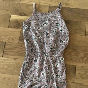 Girls one piece romper with cross front. M (8-10)